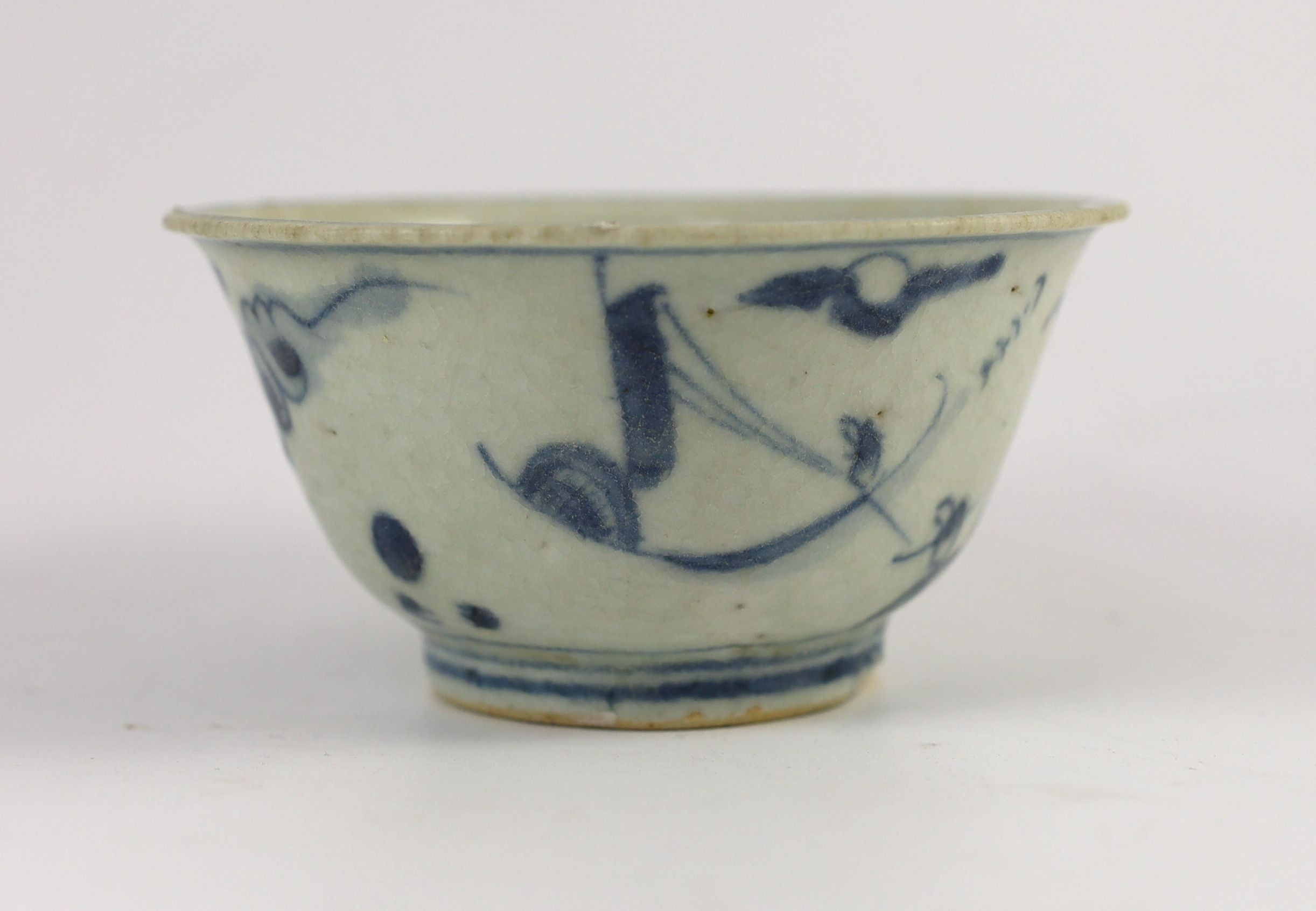 A Chinese Transitional inscribed blue and white bowl, mid 17th century, 12cm diameter, cracked